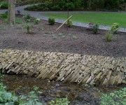 Our waterfall and streamside stonework at the aptly named Thunder Bridge.