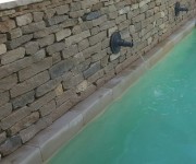 Our dry-stone walling provides a tasteful backdrop to this swimming pool in Norfolk.