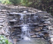 Our waterfall and streamside stonework at the aptly named Thunder Bridge.