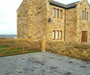Dry-stone walls and pillars to a house in Upper Cumberworth.
