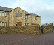 Dry-stone walls and pillars to a house in Upper Cumberworth.