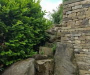 Dry-stone walls to a beautiful and private vicarage garden. One of our more monumental works.
