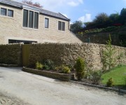 Our dry-stone walls providing security to a lovely house and garden at High Burton.