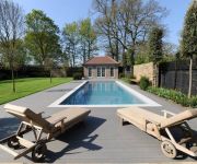 Here we have built dry-stone walls as feature elements to a swimming pool and pond in a garden at Richmond London.