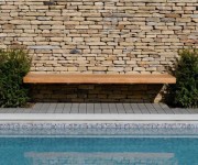 Here we have built dry-stone walls as feature elements to a swimming pool and pond in a garden at Richmond London.